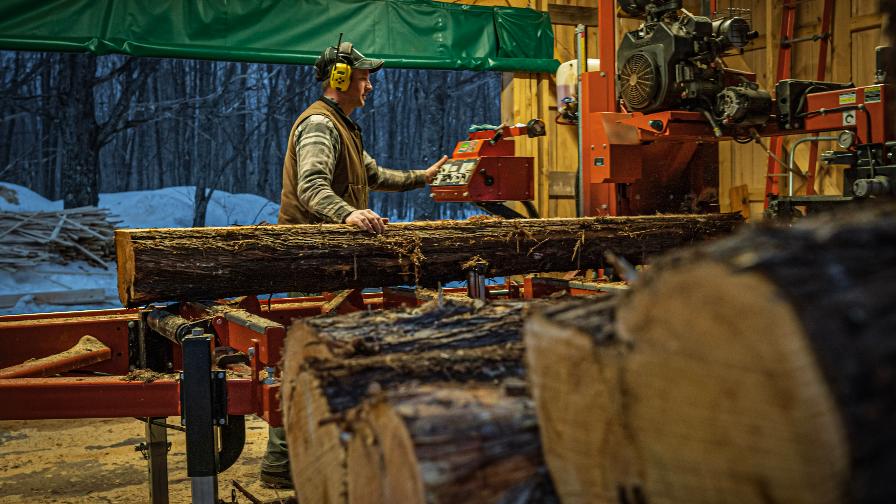Backwoods Lumber sawing logs